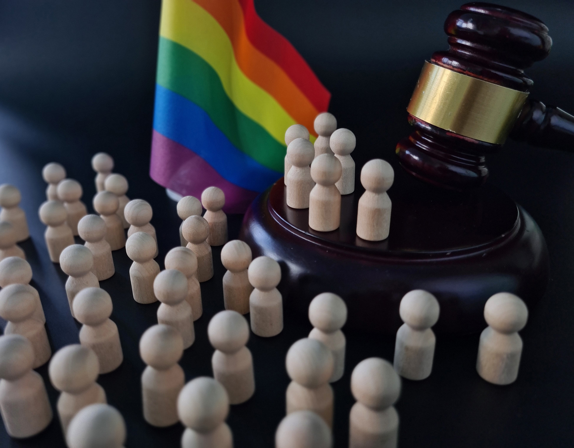 LGBT rights and laws and LGBT flag blocks in courtroom and judge. Protection of the rights of law and sexual minorities